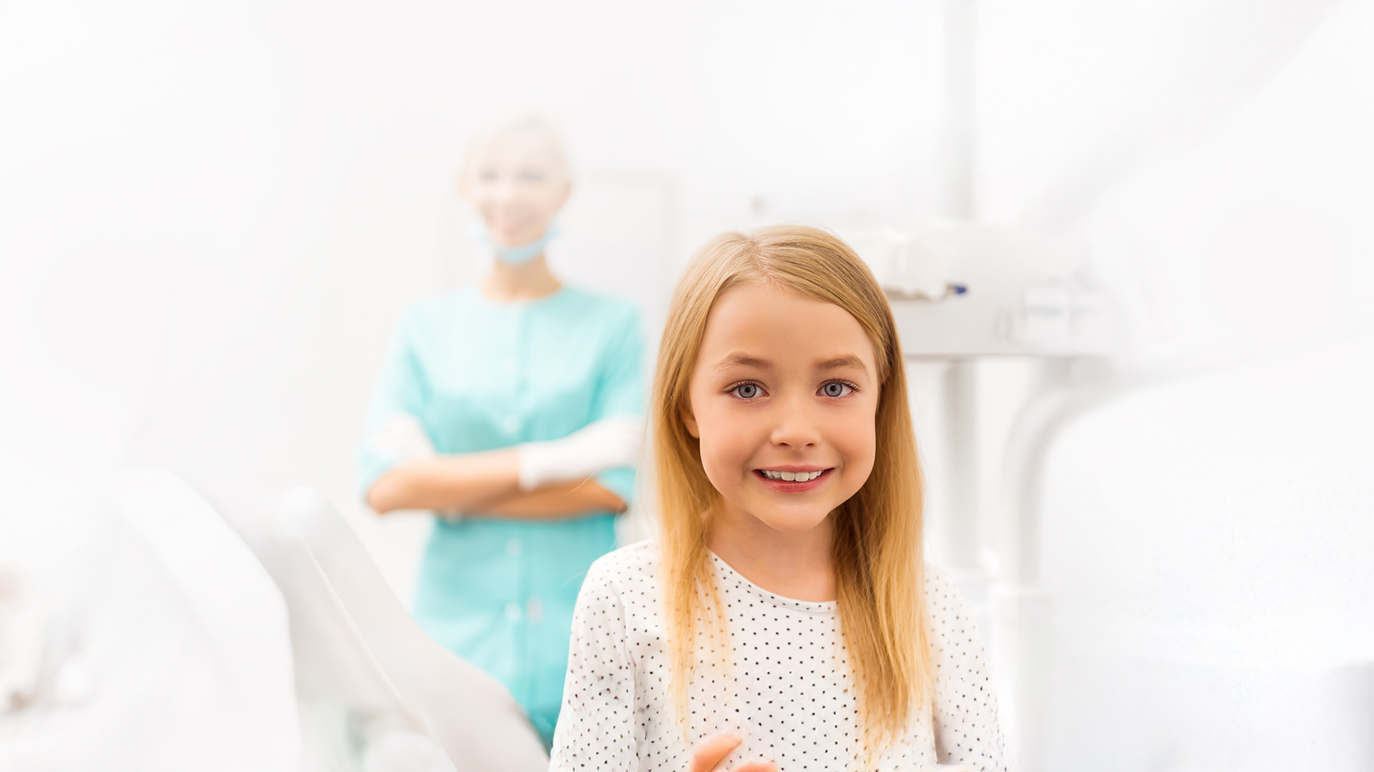 Young girl in pediatric dental office smiling