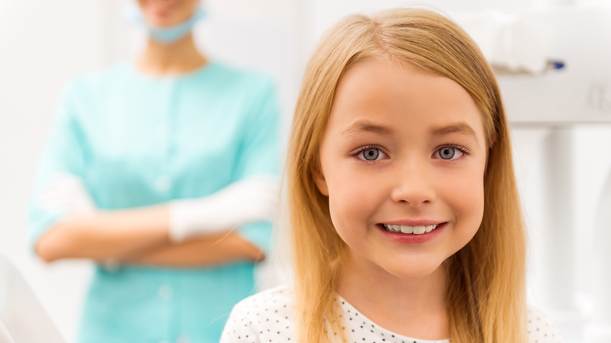 Young girl in pediatric dental office smiling