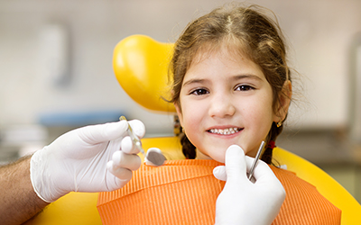A young girl visiting the dentist